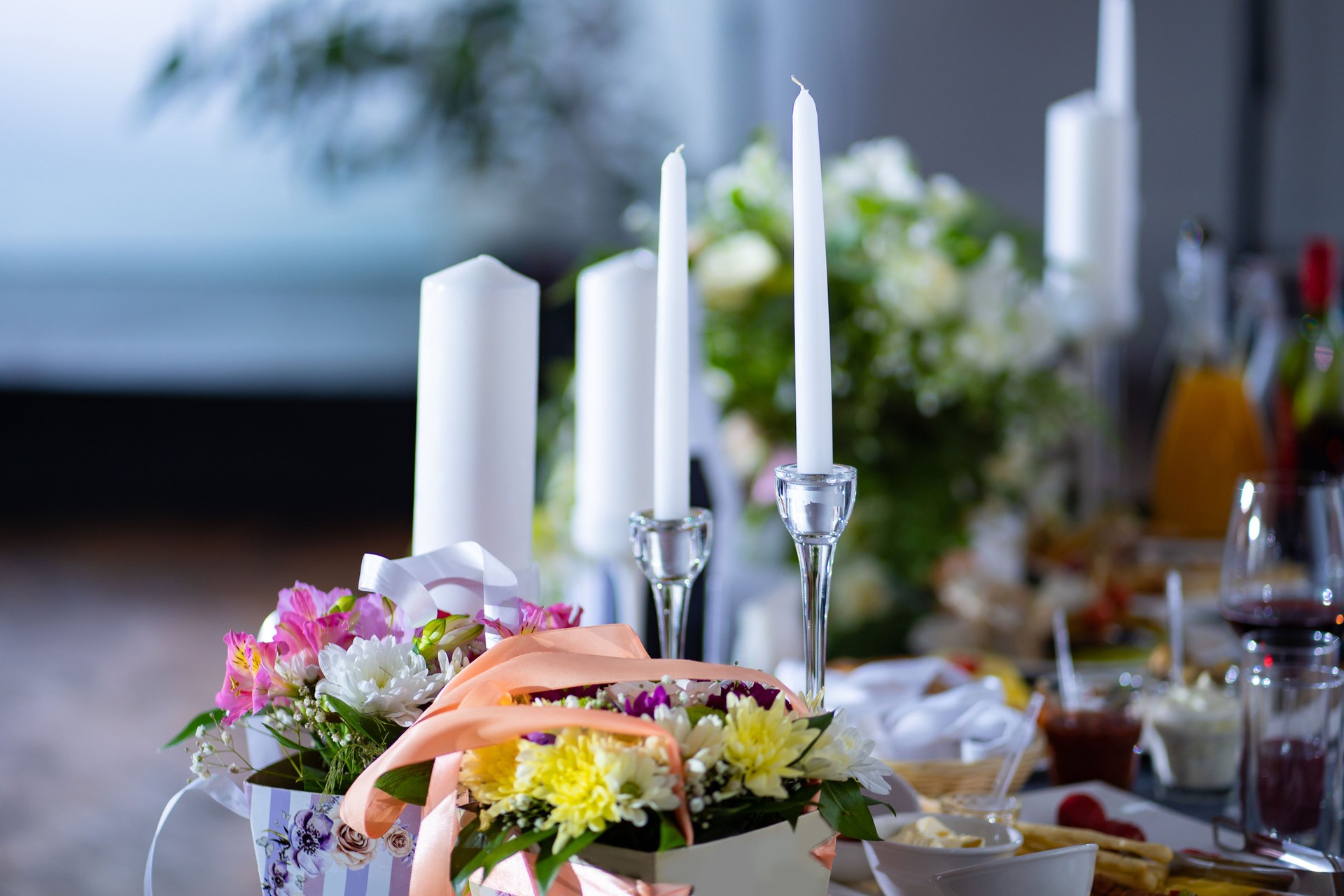 flowers and candles on holiday table. Banquet decoration for wedding or Valentine day.